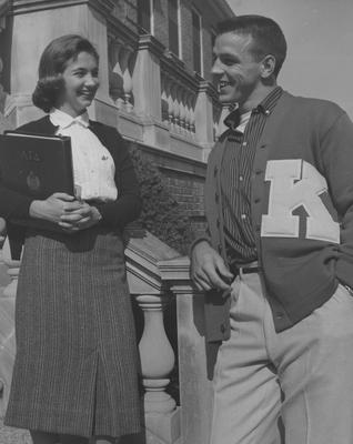 Pat Nallinger talks to an unidentified male student