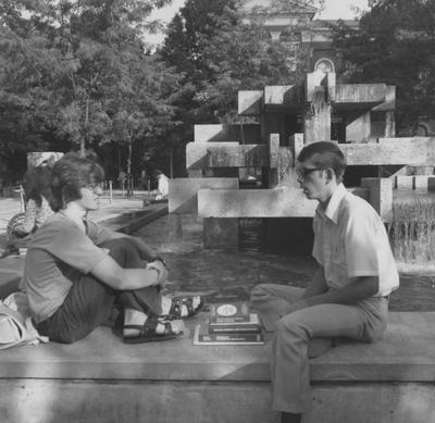 Students talk at the fountain located in front of the Patterson Office Tower