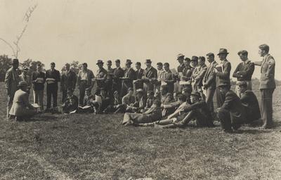 Men in a field; Man standing on farthest left is Johnson Stokes
