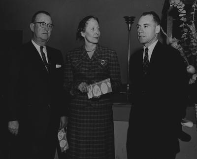 N. R. Elliot (left) and Dr. Roff S. Reich (right) with an unidentified woman