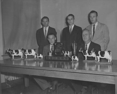 Men with trophies; Seated: Clyde Allen, Floyd Hall; Standing: Richie H. Lowe, J. Smith Mitchell, Archie Church