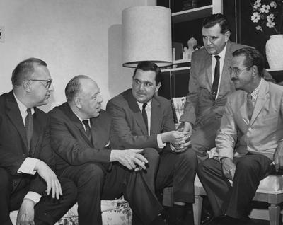 Journalists, architects, participating in a get together at Carnahan House preceding the opening of a journalism and architects conference at the University Of Kentucky; From left to right: John Schurko, Pittsburgh, Pennsylvania, member of the board of AIA and national public relations committee; Dick Battle, columnist, Nashville Banner, Nashville, Tennessee; Richard A. Miller, assistant dean, Columbia University School of Architecture, New York, New York; George McCue, art critic, St. Louis Post Dispatch, St. Louis, Missouri; and Grady Clay, real estate editor, Louisville Courier Journal, Louisville, Kentucky; Lexington Herald - Leader staff photo