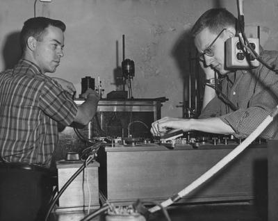 Little - known liquids with high dissolving ability are being studied by Jerry Berger (left) and Joe Vaughn (right), graduate students at the University of Kentucky