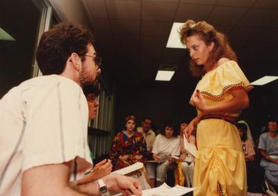 Tony Houston (left) judges a female student at the Foreign Language Festival, which was held in the Student Center on the University of Kentucky campus