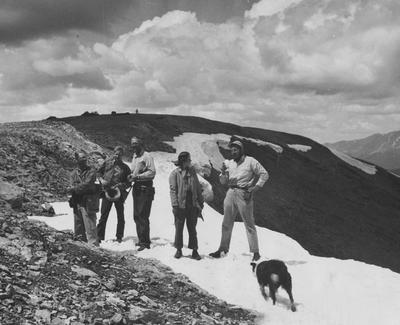 Geological group atop a snowy mountain in Colorado