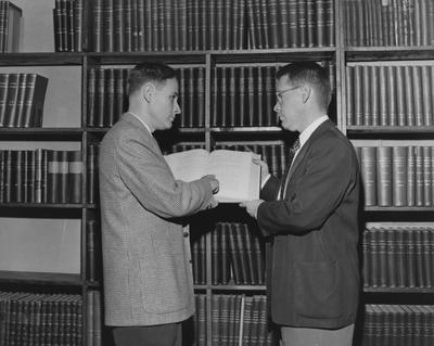 Dr. V. F. Cowling (left) is directing a research contract awarded to the University of Kentucky Department of Mathematics by the National Science Foundation; Also pictured is Joseph B. Cornelison of Berea, a graduate student at the University