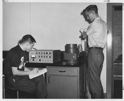 Men counting in a Zoology lab