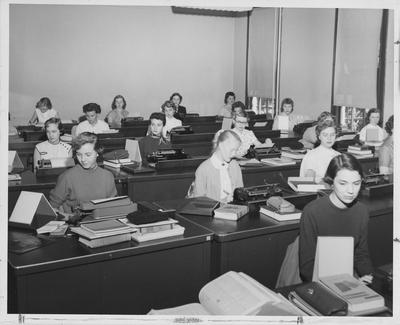Women in a typing class; Willa Tussey, left front