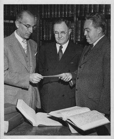 Fred Wachs, representing the Kentucky Press Association, presents a check to President Herman Lee Donovan and Dr. Niel Plummer; Photographer: Lexington Herald - Leader