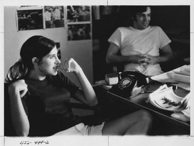 Kentuckian staff members talking in an office; This image is in the 1969 Kentuckian on page 444, image 2