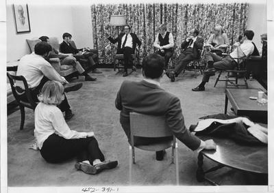 Peter Schrag (seated, sixth from right), executive editor of Saturday Review, is speaking with the Kernel staff; This image is in the 1969 Kentuckian on page 391, image 1