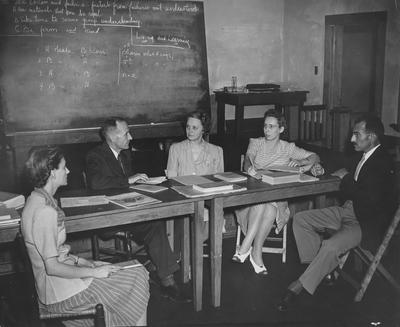 Men and women in a classroom; Photographer: Roy N. Walters