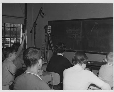 Television camera in the background transmits classroom teaching to a College of Education class