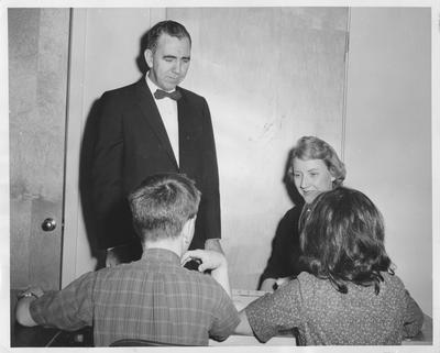 Dr. Wallace Ramsey and Dorothy Dohoney, his assistant, watch two students in the reading clinic at the University of Kentucky play 