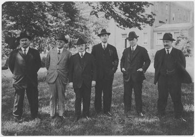 Dean F. Paul Anderson, third from the left with some of the College of Engineering faculty:  Joseph Dicker (far left) and John Dicker (far right)