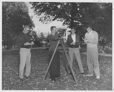 Men using equipment to survey