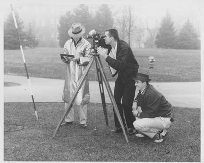 Men using equipment to survey