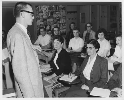 A man addressing a classroom