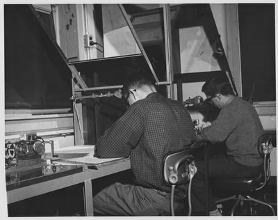 Men at a drafting table