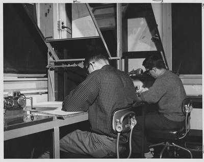 Men at a drafting table