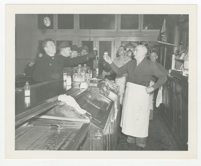 Otto Pop Gruner, owner of the Main Spring Bar having a beer with one of his customers
