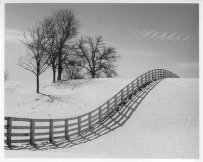 Reflection of a fence in the snow, 