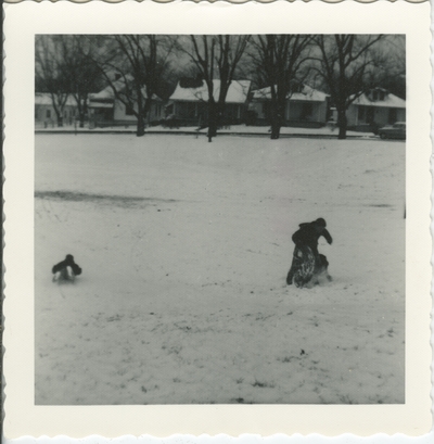 appears to be same boy and dog as in in item #13 playing in the snow