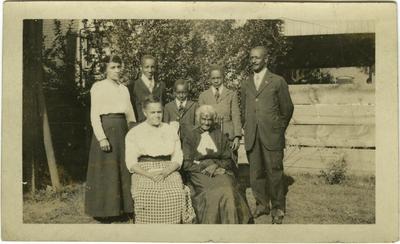 Group photo of three unidentified African American females, three unidentified African American male children, one unidentified African American male