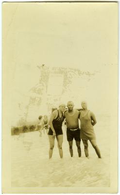 William Green and two unidentified African American females posing in a pool of water