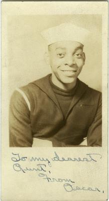 Unidentified African American male in Navy uniform; written on front 