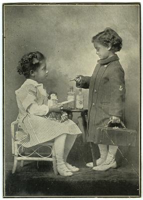Advertisement picturing unidentified African American male child and African American female child