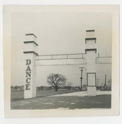 Dance Swim Play amusement facility, Joyland Park; front pillar entrance view from left, field in background