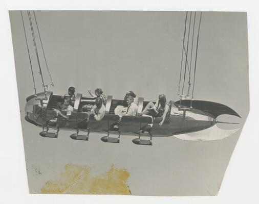 People on Rocket swing in the air, amusement attraction, Joyland Park  - stamped on back of photograph MACK HUGHES PHOTOGRAPH 503 E. HIGH LEXINGTON, KY