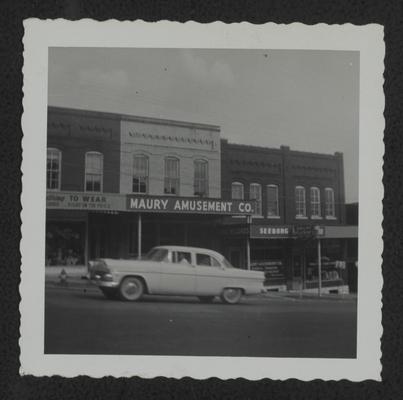 Four stores owned by Uncle John W. Johnson, one block from city square, Maury, TN