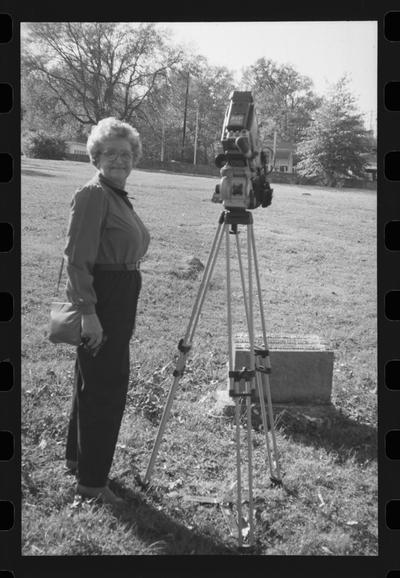 Niece in cemetary and television camera, Columbia, Tennessee