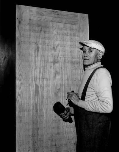 John Jacob Niles carving the doors for St. Hubert's Church, Boot Hill Farm; Jack Cobb