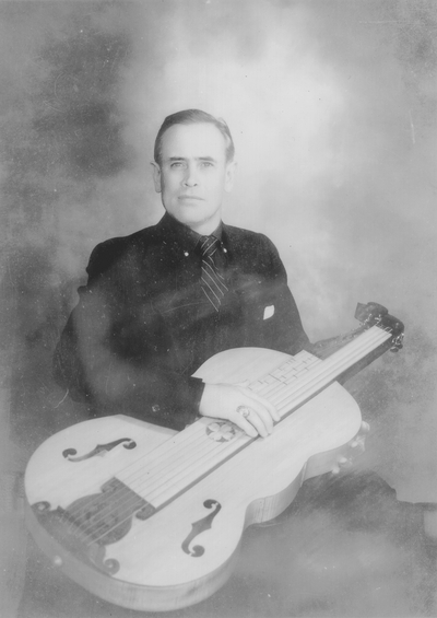 John Jacob Niles holding dulcimer