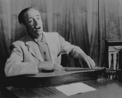 John Jacob Niles posed with dulcimer