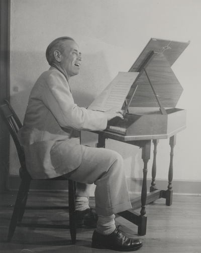 John Jacob Niles seated at harpsichord made by John Challis of Michigan; Boot Hill Farm