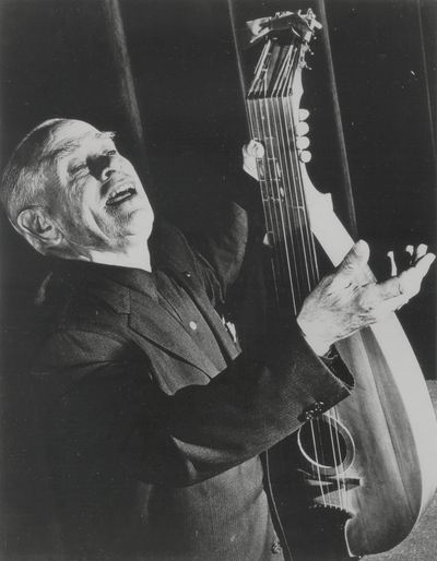 John Jacob Niles singing with dulcimer; Used as Publicity photo