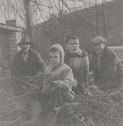Hauling wood at Boot Hill Farm; Left to right: Robert Hicks, John Ed, Tom, and John Jacob Niles