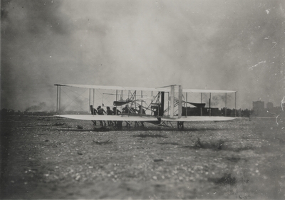 Wright Brothers' aeroplane being carried across a field; Paul Thompson