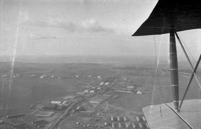 View from cockpit of biplane, over wing