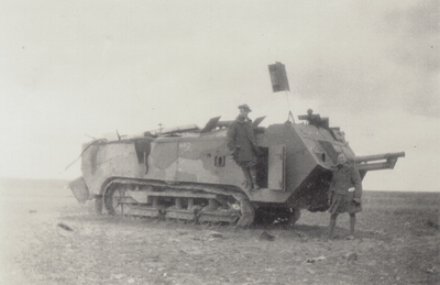 Military personnel in the field: two men with a tank