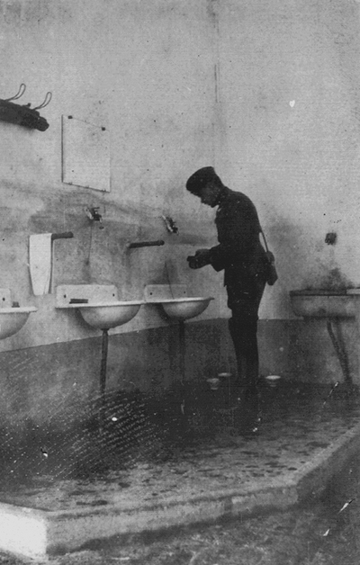 Soldier washing hands at sink