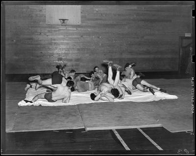 Wrestlers & boxers, men wrestling on floor (1938                             Kentuckian) (University of Kentucky)