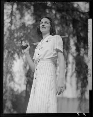Unidentified girl holding a tennis racquet on her shoulder; (1940                             Kentuckian) (University of Kentucky)