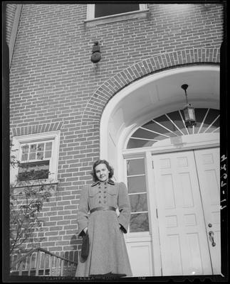 Dorothy Beeler standing in front of an entranceway to an                             unidentified building; (1940 Kentuckian) (University of                             Kentucky)