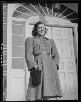 Dorothy Beeler standing in front of an entranceway to an                             unidentified building; (1940 Kentuckian) (University of                             Kentucky)
