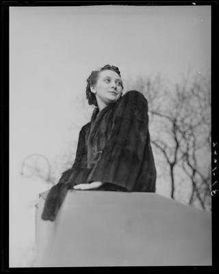 Gean Tye sitting on wall next to steps; (1940 Kentuckian)                             (University of Kentucky)